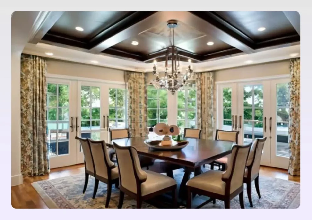 A dark wood tray ceiling over a formal dining area