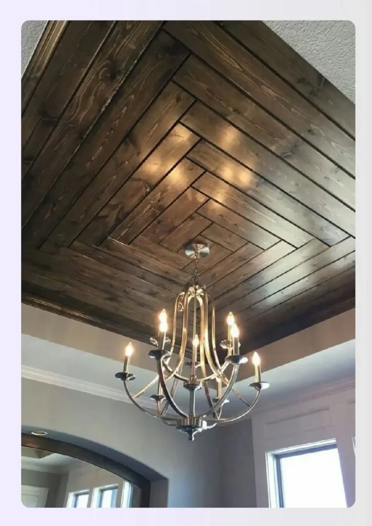 A modern tray ceiling with a geometric wood pattern