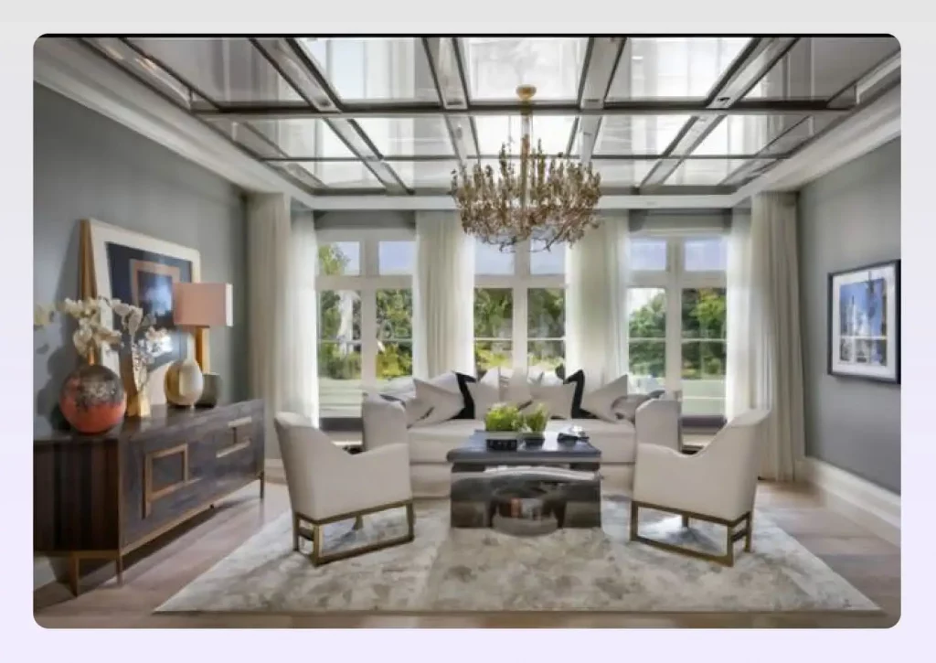 A tray ceiling with mirror panels reflecting a chandelier