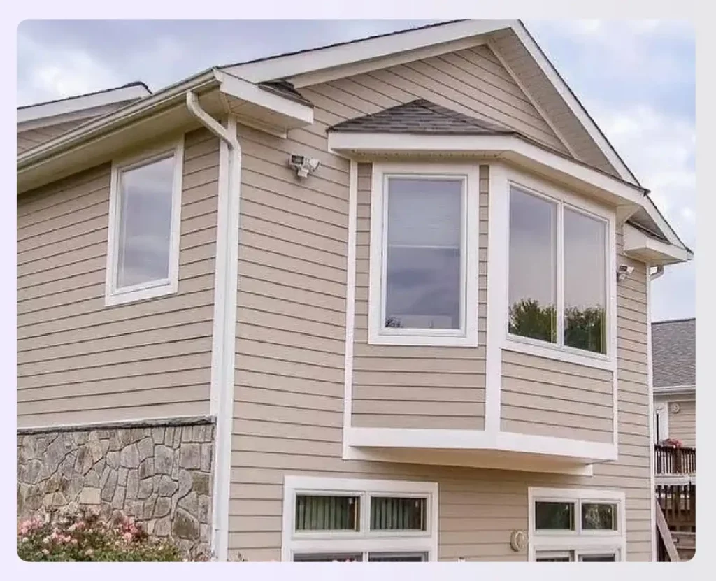 A two-story bump-out addition with a bay window A two-story bump-out addition with a bay window
