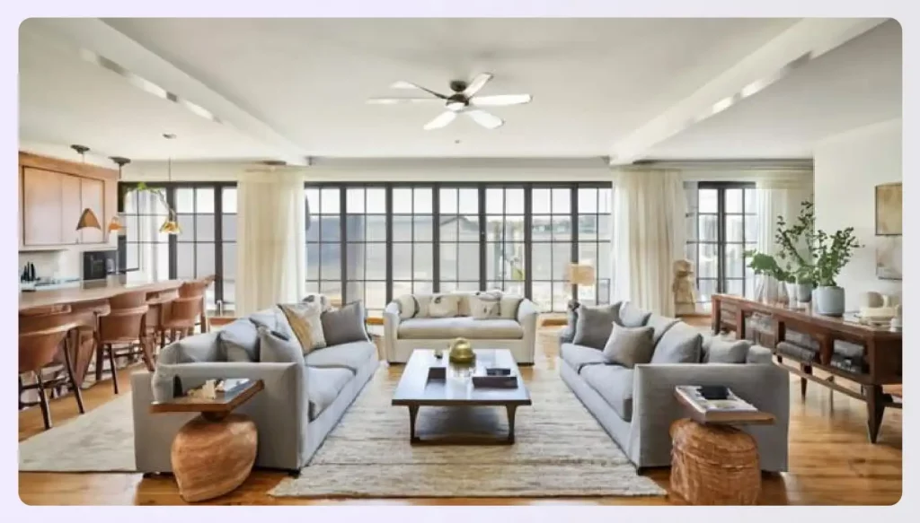 An open-plan living room with furniture arranged to create zones