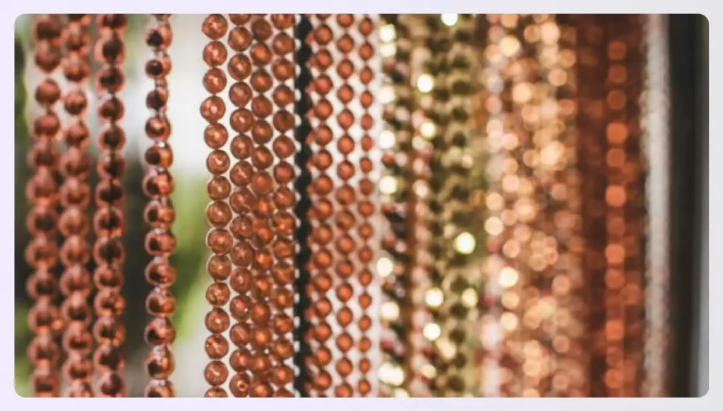 Close-up of brown and gold bead curtains