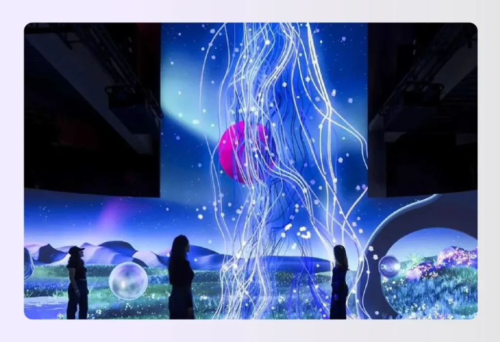 Digital art projected onto curved walls in an exhibit Digital art projected onto curved walls in an exhibit