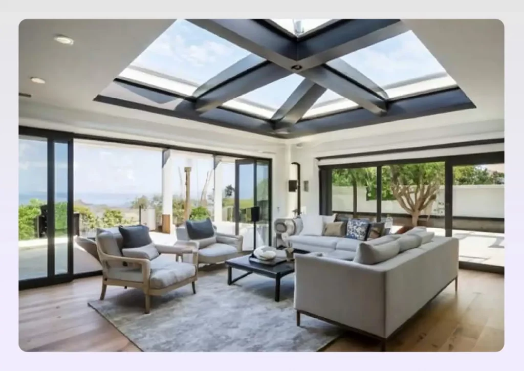Large skylights integrated into a black-framed tray ceiling