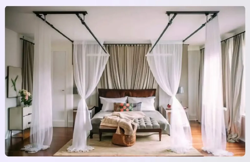 Sheer curtains creating a canopy bed divider