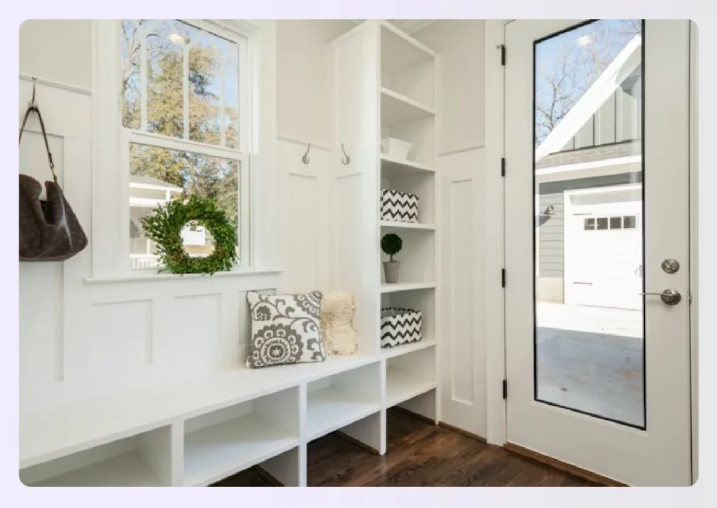White mudroom with built-in storage and hooks White mudroom with built-in storage and hooks
