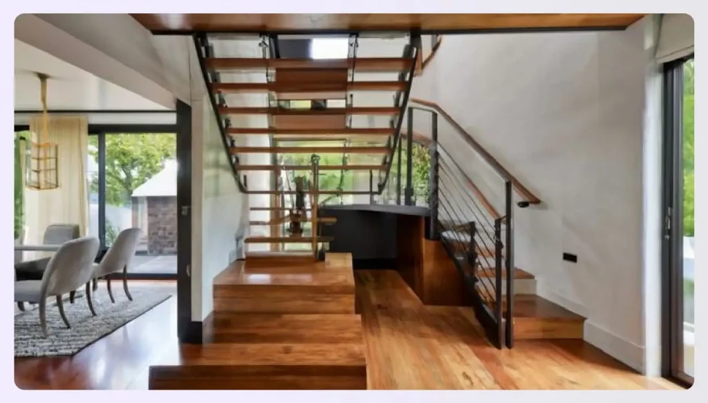 Wooden steps leading up from a dining area